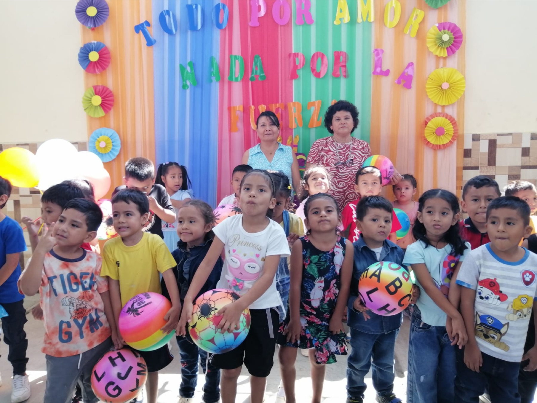 Children and community leaders gathered together at a joyful outreach event in Peru